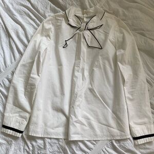 This white bow blouse with some black lining from Mayoral, size 12 kids.
